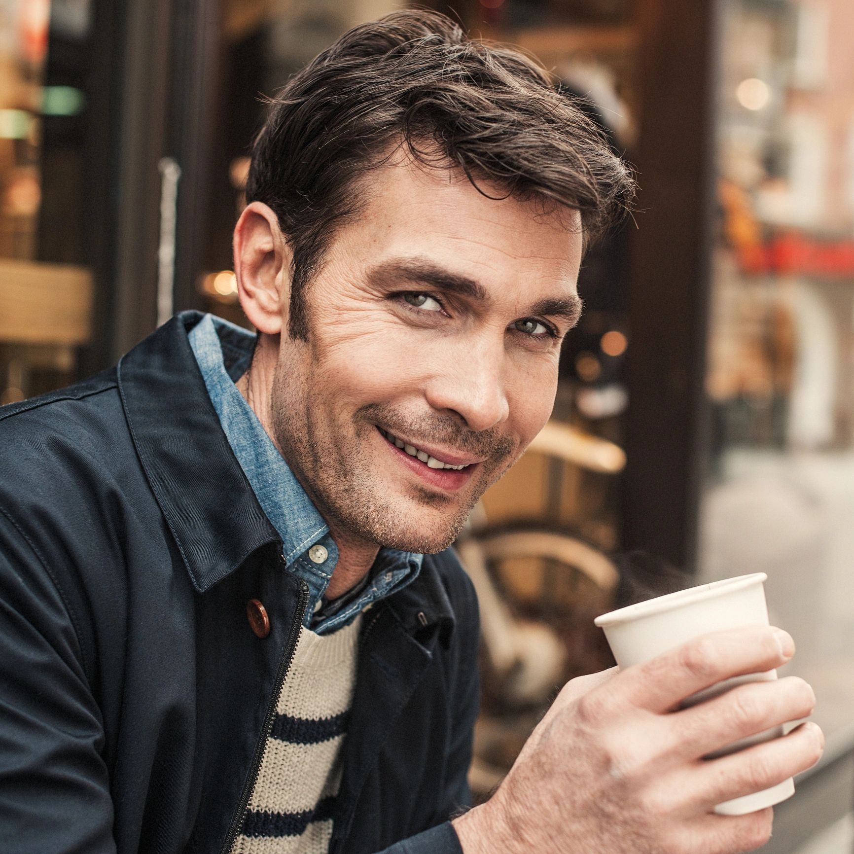 Portrait of customer enjoying coffee